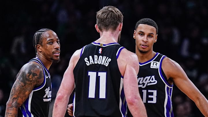 Jan 10, 2025; Boston, Massachusetts, USA; Sacramento Kings forward DeMar DeRozan (10), forward Keegan Murray (13) and forward Domantas Sabonis (11) react after defeating the Boston Celtics at TD Garden. Images Jan 10, 2025; Boston, Massachusetts, USA; Sacramento Kings forward DeMar DeRozan (10), forward Keegan Murray (13) and forward Domantas Sabonis (11) react after defeating the Boston Celtics at TD Garden. Images