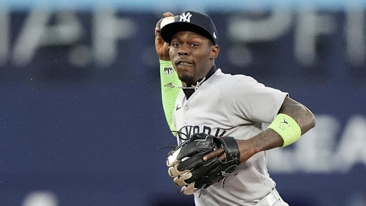 Oct 5, 2025; Toronto, Ontario, CAN; New York Yankees second baseman Jazz Chisholm Jr. (13) throws to first in the seventh inning against the Toronto Blue Jays during game two of the ALDS round for the 2025 MLB playoffs at Rogers Centre. Mandatory Credit: John E. Sokolowski-Imagn Images