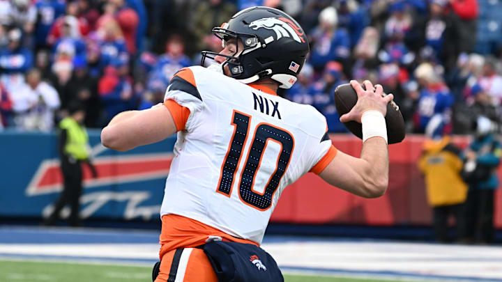 Jan 12, 2025; Orchard Park, New York, USA; Denver Broncos quarterback Bo Nix (10) throws downfield during the first quarter against the Buffalo Bills in an AFC wild card game at Highmark Stadium. Jan 12, 2025; Orchard Park, New York, USA; Denver Broncos quarterback Bo Nix (10) throws downfield during the first quarter against the Buffalo Bills in an AFC wild card game at Highmark Stadium.