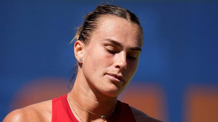 Aryna Sabalenka reacts during her loss
