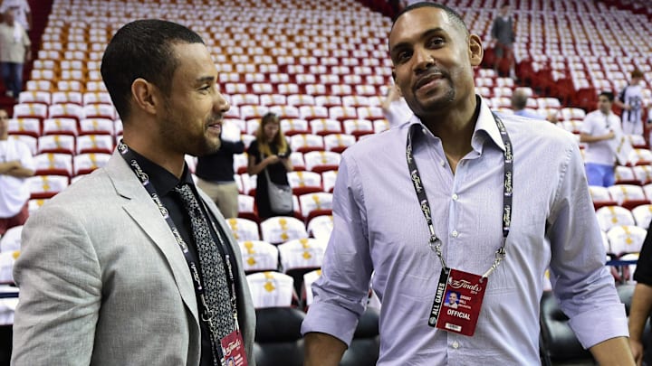 Former players Trajan Langdon (left) and Grant Hill (right) talk prior to game four of the 2014 NBA Finals between the Miami Heat and the San Antonio Spurs at American Airlines Arena.