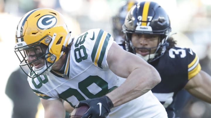 Green Bay Packers tight end Luke Musgrave (88) runs after a catch against Pittsburgh Steelers safety Elijah Riley in 2023. Green Bay Packers tight end Luke Musgrave (88) runs after a catch against Pittsburgh Steelers safety Elijah Riley in 2023.