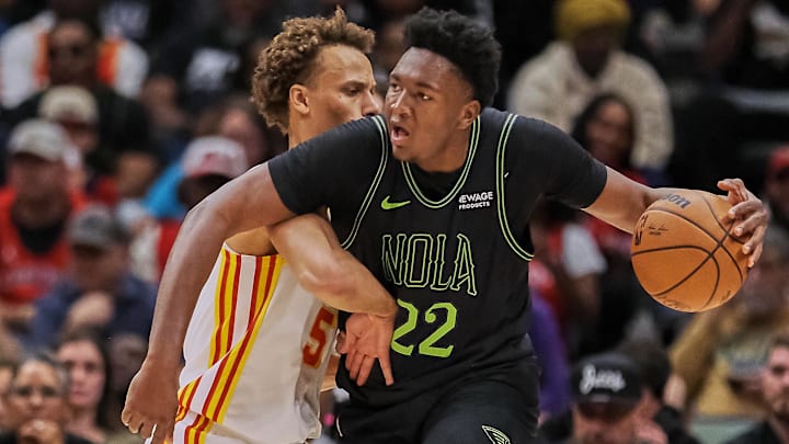 Nov 22, 2025; New Orleans, Louisiana, USA;  Atlanta Hawks guard Dyson Daniels (5) guards New Orleans Pelicans center Derik Queen (22) during the first half of the game at Smoothie King Center. Mandatory Credit: Daniel Anderson-Imagn Images