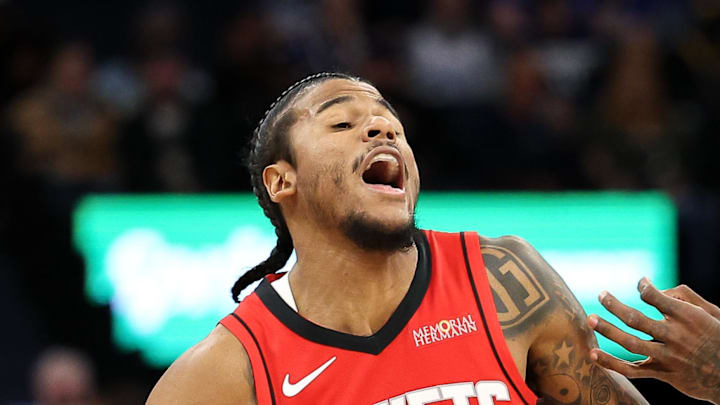 Feb 6, 2025; Minneapolis, Minnesota, USA; Houston Rockets guard Jalen Green (4) works around Minnesota Timberwolves forward Jaden McDaniels (3) during the second quarter at Target Center. Mandatory Credit: Matt Krohn-Imagn Images