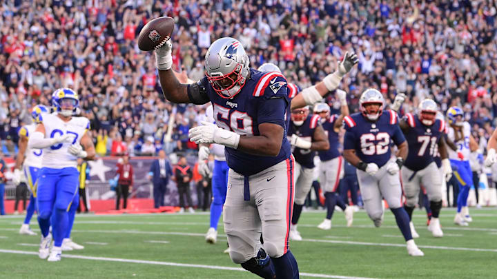 Nov 17, 2024; Foxborough, Massachusetts, USA; New England Patriots offensive tackle Vederian Lowe (59) makes a catch for a touchdown against the Los Angeles Rams during the second half at Gillette Stadium. Mandatory Credit: Eric Canha-Imagn Images Nov 17, 2024; Foxborough, Massachusetts, USA; New England Patriots offensive tackle Vederian Lowe (59) makes a catch for a touchdown against the Los Angeles Rams during the second half at Gillette Stadium. Mandatory Credit: Eric Canha-Imagn Images