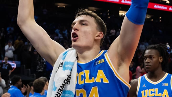 Dec 14, 2024; Phoenix, Arizona, USA; UCLA Bruins forward Tyler Bilodeau (34) celebrates after defeating the Arizona Wildcats at Footprint Center. Mandatory Credit: Mark J. Rebilas-Imagn Images