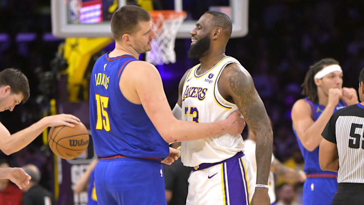 Mar 2, 2024; Los Angeles, California, USA;  Los Angeles Lakers forward LeBron James (23) is greeted by Denver Nuggets center Nikola Jokic (15) at the start of the game at Crypto.com Arena. Mandatory Credit: Jayne Kamin-Oncea-Imagn Images