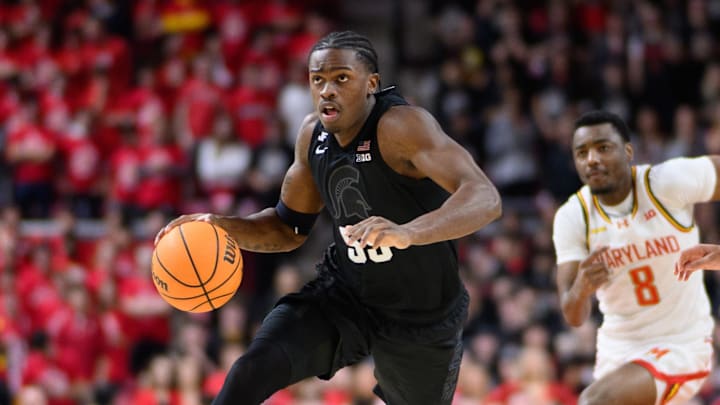 Feb 26, 2025; College Park, Maryland, USA; Michigan State Spartans forward Coen Carr (55) handles the ball during the first half against Maryland Terrapins guard Rodney Rice (1) at Xfinity Center. Mandatory Credit: Reggie Hildred-Imagn Images Feb 26, 2025; College Park, Maryland, USA; Michigan State Spartans forward Coen Carr (55) handles the ball during the first half against Maryland Terrapins guard Rodney Rice (1) at Xfinity Center. Mandatory Credit: Reggie Hildred-Imagn Images