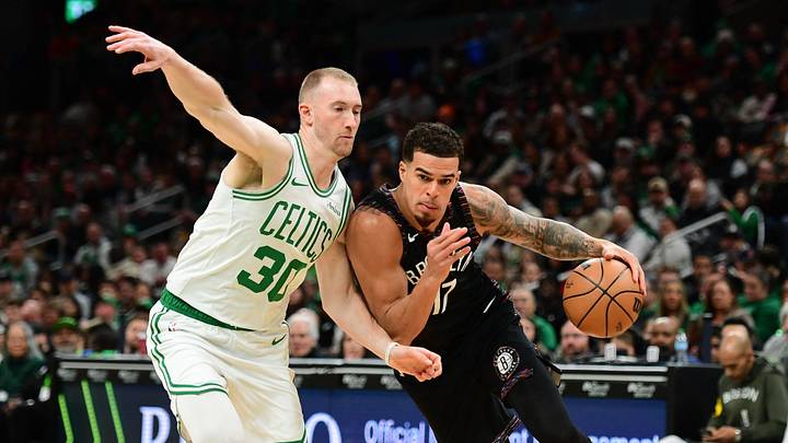 Feb 27, 2026; Boston, Massachusetts, USA; Brooklyn Nets forward Michael Porter Jr. (17) controls the ball while Boston Celtics forward Sam Hauser (30) defends during the first half at TD Garden. Mandatory Credit: Bob DeChiara-Imagn Images
