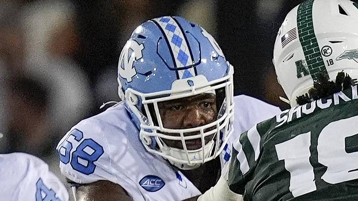 Sep 6, 2025; Charlotte, North Carolina, USA; North Carolina Tar Heels tight end Jake Johnson (19) and offensive lineman Aidan Banfield (68) double-team Charlotte 49ers defensive lineman Zion Shockley (18) during the first half at Jerry Richardson Stadium. Mandatory Credit: Jim Dedmon-Imagn Images Sep 6, 2025; Charlotte, North Carolina, USA; North Carolina Tar Heels tight end Jake Johnson (19) and offensive lineman Aidan Banfield (68) double-team Charlotte 49ers defensive lineman Zion Shockley (18) during the first half at Jerry Richardson Stadium. Mandatory Credit: Jim Dedmon-Imagn Images