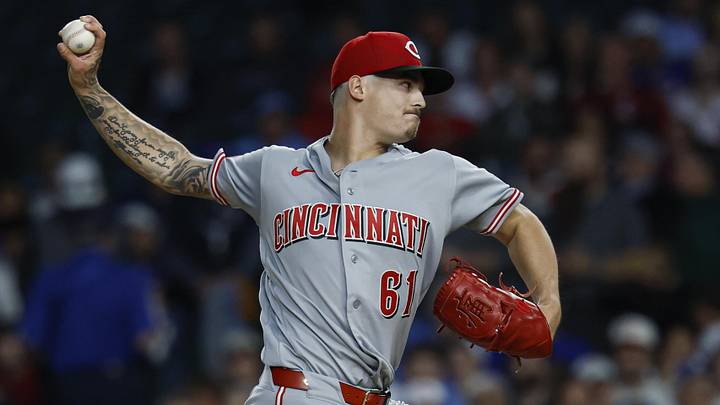 Cincinnati Reds starting pitcher Chase Petty (61) delivers a pitch