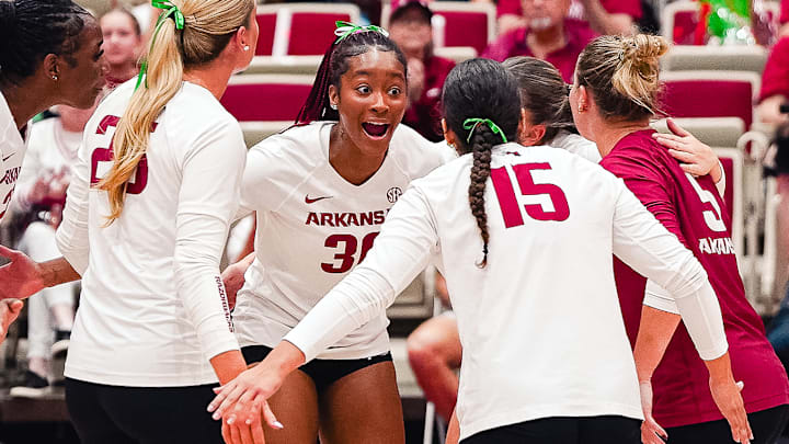 Arkansas volleyball players celebrate a point won in Friday night's match against Georgia. Arkansas volleyball players celebrate a point won in Friday night's match against Georgia.