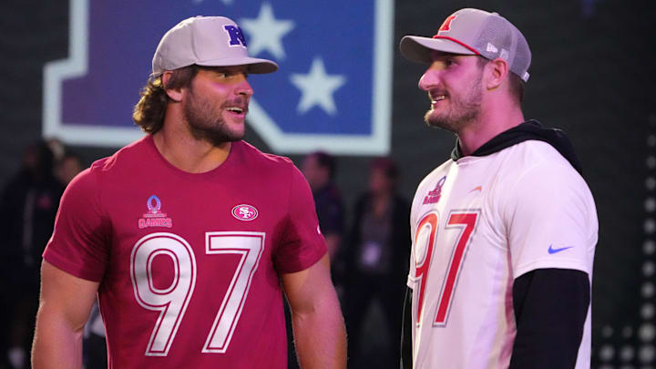 Jan 30, 2025; Orlando, FL, USA; NFC defensive end Nick Bosa of the San Francisco 49ers (left) with brother and AFC linebacker Joey Bosa during the Pro Bowl Skills Challenge at Nicholson Fieldhouse. Mandatory Credit: Kirby Lee-Imagn Images