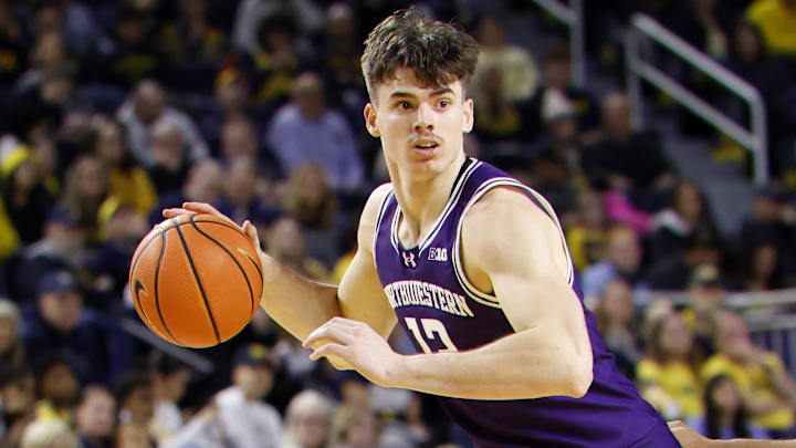 Jan 19, 2025; Ann Arbor, Michigan, USA;  Northwestern Wildcats guard Brooks Barnhizer (13) dribbles in the second half against the Michigan Wolverines at Crisler Center. Mandatory Credit: Rick Osentoski-Imagn Images