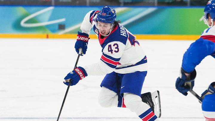 Feb 20, 2026; Milan, Italy; Quinn Hughes (43) of the United States moves the puck up the ice as Erik Cernak (81) of Slovakia defends during the second period in a men's ice hockey semifinal during the Milano Cortina 2026 Olympic Winter Games at Milano Santagiulia Ice Hockey Arena. Mandatory Credit: James Lang-Imagn Images