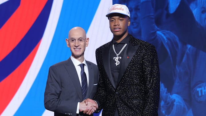 Jun 25, 2025; Brooklyn, NY, USA; Thomas Sorber stands with NBA commissioner Adam Silver after being selected as the 15th pick by the Oklahoma City Thunder in the first round of the 2025 NBA Draft at Barclays Center. Mandatory Credit: Brad Penner-Imagn Images Jun 25, 2025; Brooklyn, NY, USA; Thomas Sorber stands with NBA commissioner Adam Silver after being selected as the 15th pick by the Oklahoma City Thunder in the first round of the 2025 NBA Draft at Barclays Center. Mandatory Credit: Brad Penner-Imagn Images