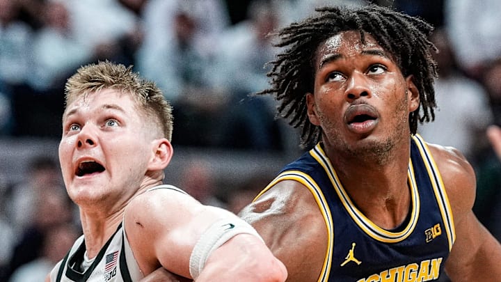 Michigan forward Morez Johnson Jr. (21), center, battle for position against Michigan State forward Jaxon Kohler (0) and guard Kur Teng (2) during the second half at Breslin Center in East Lansing on Friday, Jan. 30, 2026.
