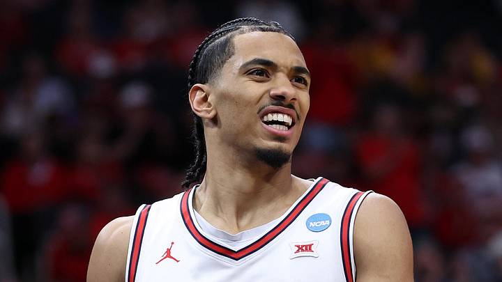 Mar 26, 2026; Houston, TX, USA; Houston Cougars guard Milos Uzan (7) reacts in the first half during a Sweet Sixteen game of the South Regional of the men's 2026 NCAA Tournament at Toyota Center. Mandatory Credit: Troy Taormina-Imagn Images