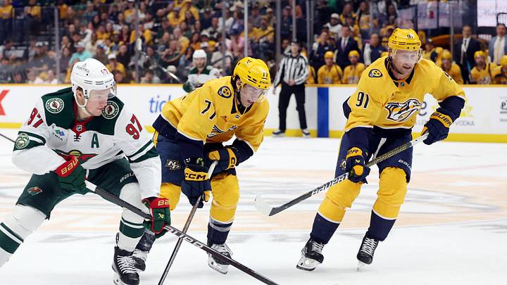 Apr 11, 2026; Nashville, Tennessee, USA; Nashville Predators right wing Luke Evangelista (77) and Nashville Predators center Steven Stamkos (91) compete for the puck with Minnesota Wild left wing Kirill Kaprizov (97) during the first period of their game at Bridgestone Arena. Mandatory Credit: Alan Poizner-Imagn Images Apr 11, 2026; Nashville, Tennessee, USA; Nashville Predators right wing Luke Evangelista (77) and Nashville Predators center Steven Stamkos (91) compete for the puck with Minnesota Wild left wing Kirill Kaprizov (97) during the first period of their game at Bridgestone Arena. Mandatory Credit: Alan Poizner-Imagn Images