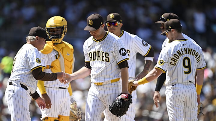 San Diego Padres starting pitcher Michael King (34), center, leaves the game during the third inning of a baseball game against the Atlanta Braves at Petco Park on March 27.