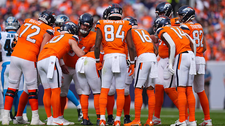 Oct 27, 2024; Denver, Colorado, USA; Denver Broncos offensive players huddle in the first half against the Carolina Panthers at Empower Field at Mile High. Oct 27, 2024; Denver, Colorado, USA; Denver Broncos offensive players huddle in the first half against the Carolina Panthers at Empower Field at Mile High.