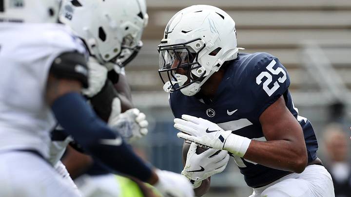 Apr 26, 2025; University Park, PA, USA; Penn State Nittany Lions Quinton Martin Jr (25) runs the ball into the end zone for a touchdown during the third quarter of the Blue White spring game at Beaver Stadium. The White team defeated the Blue team 10-8. Mandatory Credit: Matthew O'Haren-Imagn Images Apr 26, 2025; University Park, PA, USA; Penn State Nittany Lions Quinton Martin Jr (25) runs the ball into the end zone for a touchdown during the third quarter of the Blue White spring game at Beaver Stadium. The White team defeated the Blue team 10-8. Mandatory Credit: Matthew O'Haren-Imagn Images