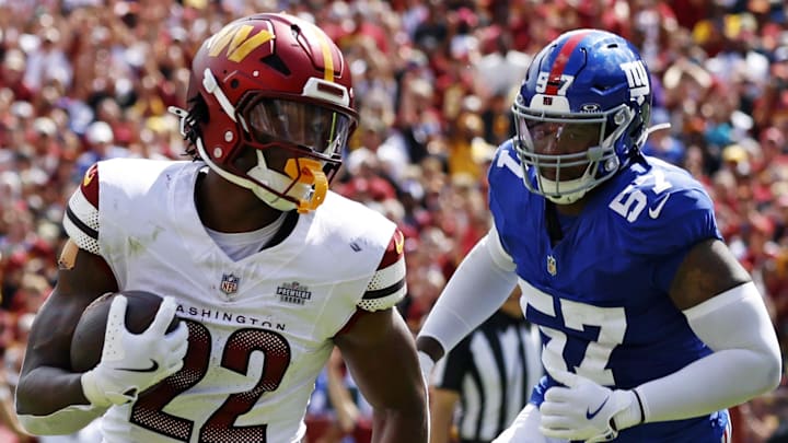Sep 7, 2025; Landover, Maryland, USA; Washington Commanders running back Jacory Croskey-Merritt (22) scores a touchdown during the second quarter against the New York Giants at Northwest Stadium. Mandatory Credit: Peter Casey-Imagn Images