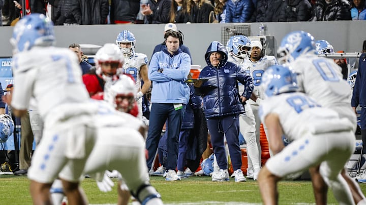 Nov 29, 2025; Raleigh, North Carolina, USA;  North Carolina Tar Heels head coach Bill Belichick on the sideline during the first half of the game against NC State Wolfpack at Carter-Finley Stadium.  Mandatory Credit: Jaylynn Nash-Imagn Images