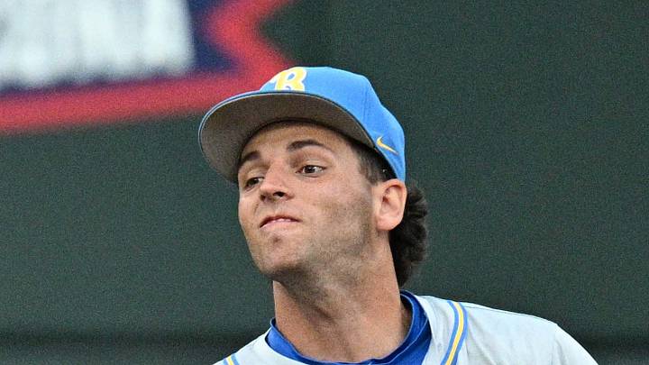 Jun 17, 2025; Omaha, Neb, USA; UCLA Bruins shortstop Roch Cholowsky (1) completes a double play after getting Arkansas Razorbacks center fielder Justin Thomas Jr. (4) out during the fifth inning at Charles Schwab Field. Mandatory Credit: Steven Branscombe-Imagn Images Jun 17, 2025; Omaha, Neb, USA; UCLA Bruins shortstop Roch Cholowsky (1) completes a double play after getting Arkansas Razorbacks center fielder Justin Thomas Jr. (4) out during the fifth inning at Charles Schwab Field. Mandatory Credit: Steven Branscombe-Imagn Images