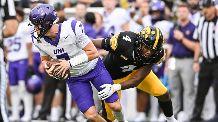 Sep 19, 2026; Iowa City, Iowa, USA;  Iowa Hawkeyes linebacker Julian Manson (4) looks to tackle UNI Panthers quarterback Cale McThenia (7) during the fourth quarter at Kinnick Stadium.  Mandatory Credit: Jeffrey Becker-Imagn Images