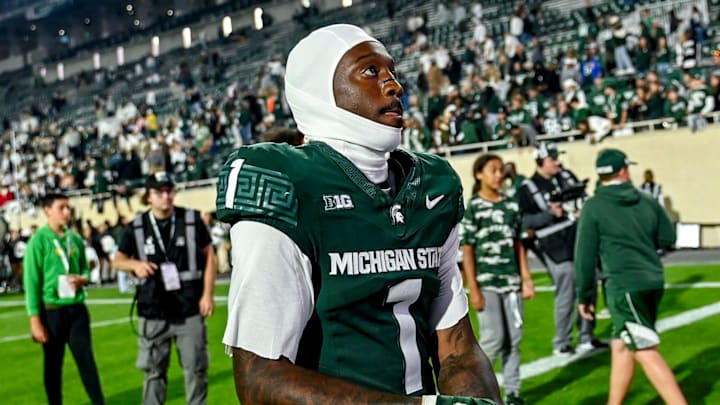 Michigan State's Omari Kelly takes his gloves off for a fan after the Spartans win over Western Michigan on Friday, Aug. 29, 2025, in East Lansing. Michigan State's Omari Kelly takes his gloves off for a fan after the Spartans win over Western Michigan on Friday, Aug. 29, 2025, in East Lansing.