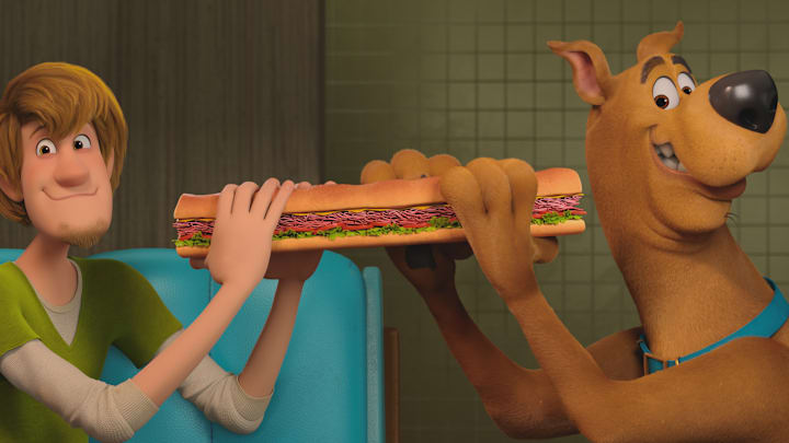 (L-r) Shaggy voiced by WILL FORTE and Scooby-Doo voiced by FRANK WELKER in the new animated adventure “SCOOB!” from Warner Bros. Pictures and Warner Animation Group. Courtesy of Warner Bros. Pictures