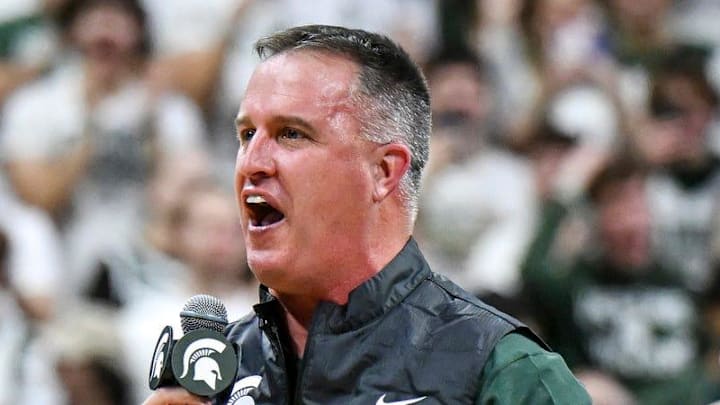 Michigan State's new football coach Pat Fitzgerald addresses the crowd during a timeout in the first half of the Spartans basketball game against Iowa on Tuesday, Dec. 2, 2025, at the Breslin Center in East Lansing.