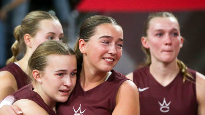 Western Christian's Breslyn Kooima (0) hugs Hadley Dekkers (2) after their team fell to Mount Vernon in the Class 3A state volleyball championship Thursday, Nov. 7, 2024 at Xtream Arena in Coralville, Iowa.