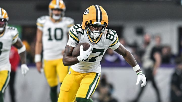 Dec 29, 2024; Minneapolis, Minnesota, USA; Green Bay Packers wide receiver Romeo Doubs (87) gets yards after the catch against the Minnesota Vikings during the fourth quarter at U.S. Bank Stadium. Mandatory Credit: Jeffrey Becker-Imagn Images