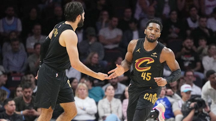 Jan 29, 2025; Miami, Florida, USA;  Cleveland Cavaliers guard Donovan Mitchell (45) is congratulated by guard Max Strus (1) after scoring against the Miami Heat during the second half at Kaseya Center. Mandatory Credit: Jim Rassol-Imagn Images