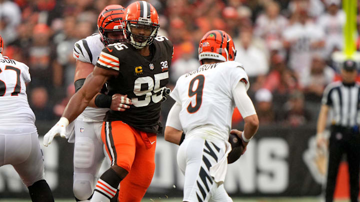 Cleveland Browns defensive end Myles Garrett (95) pressured Cincinnati Bengals quarterback Joe Burrow (9) as Cincinnati Bengals center Ted Karras (64) blocks in the first quarter of an NFL football game between the Cincinnati Bengals and Cleveland Browns, Sunday, Sept. 10, 2023, at Cleveland Browns Stadium in Cleveland. Cleveland Browns defensive end Myles Garrett (95) pressured Cincinnati Bengals quarterback Joe Burrow (9) as Cincinnati Bengals center Ted Karras (64) blocks in the first quarter of an NFL football game between the Cincinnati Bengals and Cleveland Browns, Sunday, Sept. 10, 2023, at Cleveland Browns Stadium in Cleveland.