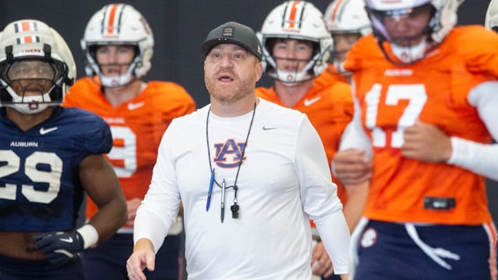 Auburn Tigers head coach Alex Golesh talks with his team during practice at Woltosz Football Performance Center in Auburn, Ala. on Thursday, April 16, 2026.