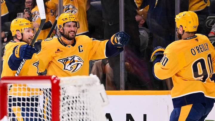 Feb 26, 2026; Nashville, Tennessee, USA; Nashville Predators center Ryan O'Reilly (90) celebrates scoring with center Steven Stamkos (91) and defenseman Roman Josi (59) against the Chicago Blackhawks during the third period at Bridgestone Arena. Mandatory Credit: Steve Roberts-Imagn Images Feb 26, 2026; Nashville, Tennessee, USA; Nashville Predators center Ryan O'Reilly (90) celebrates scoring with center Steven Stamkos (91) and defenseman Roman Josi (59) against the Chicago Blackhawks during the third period at Bridgestone Arena. Mandatory Credit: Steve Roberts-Imagn Images