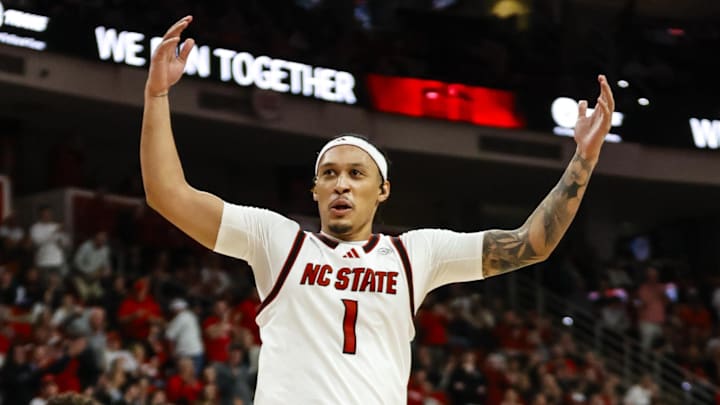 Jan 27, 2026; Raleigh, North Carolina, USA; NC State Wolfpack forward Darrion Williams (1) celebrates during the second half of the game against the Syracuse Orange at Lenovo Center. Mandatory Credit: Jaylynn Nash-Imagn Images