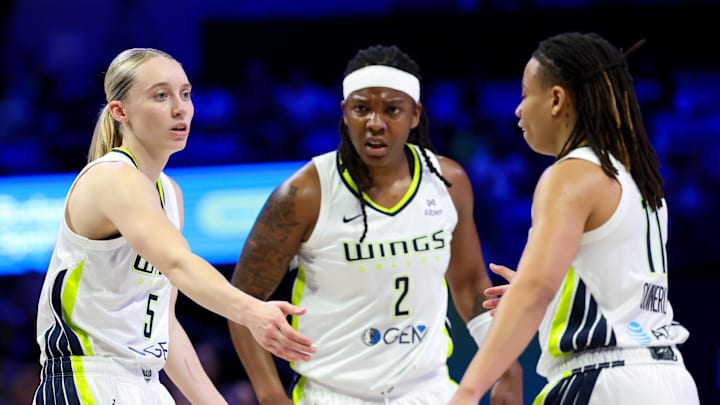 Jul 3, 2025; Arlington, Texas, USA; Dallas Wings guard Paige Bueckers (5) celebrates with Dallas Wings forward Myisha Hines-Allen (2) and Dallas Wings guard JJ Quinerly (11) against the Phoenix Mercury during the first half at College Park Center. Mandatory Credit: Kevin Jairaj-Imagn Images Jul 3, 2025; Arlington, Texas, USA; Dallas Wings guard Paige Bueckers (5) celebrates with Dallas Wings forward Myisha Hines-Allen (2) and Dallas Wings guard JJ Quinerly (11) against the Phoenix Mercury during the first half at College Park Center. Mandatory Credit: Kevin Jairaj-Imagn Images