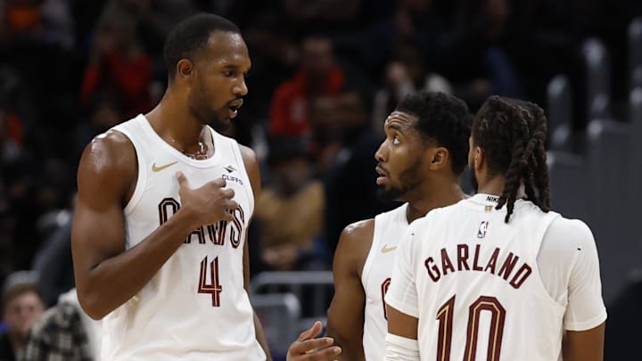Dec 12, 2025; Washington, District of Columbia, USA; Cleveland Cavaliers guard Donovan Mitchell (45) talks with Cavaliers center Evan Mobley (4) and Cavaliers guard Darius Garland (10) during a stoppage in play against the Washington Wizards in the second half at Capital One Arena. Mandatory Credit: Geoff Burke-Imagn Images