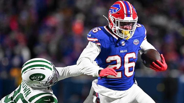 Buffalo Bills running back Ty Johnson carries the ball defended by New York Jets cornerback Tre Brown. Buffalo Bills running back Ty Johnson carries the ball defended by New York Jets cornerback Tre Brown.