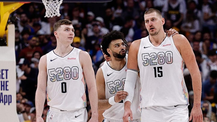 May 15, 2025; Denver, Colorado, USA; Denver Nuggets guard Jamal Murray (27) and center Nikola Jokic (15) and guard Christian Braun (0) in the fourth quarter against the Oklahoma City Thunder during game six of the second round for the 2025 NBA Playoffs at Ball Arena. Mandatory Credit: Isaiah J. Downing-Imagn Images