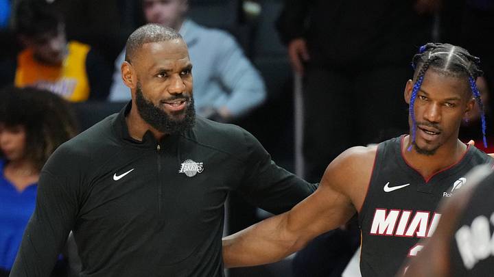 Dec 4, 2024; Miami, Florida, USA;  Los Angeles Lakers forward LeBron James (23) and Miami Heat forward Jimmy Butler (22) greet each other following the game at the Kaseya Center. Mandatory Credit: Jim Rassol-Imagn Images