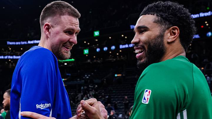 Mar 18, 2026; Boston, Massachusetts, USA; Golden State Warriors center Kristaps Porzingis (7) talks with Boston Celtics forward Jayson Tatum (0) after the game at TD Garden. Mandatory Credit: David Butler II-Imagn Images