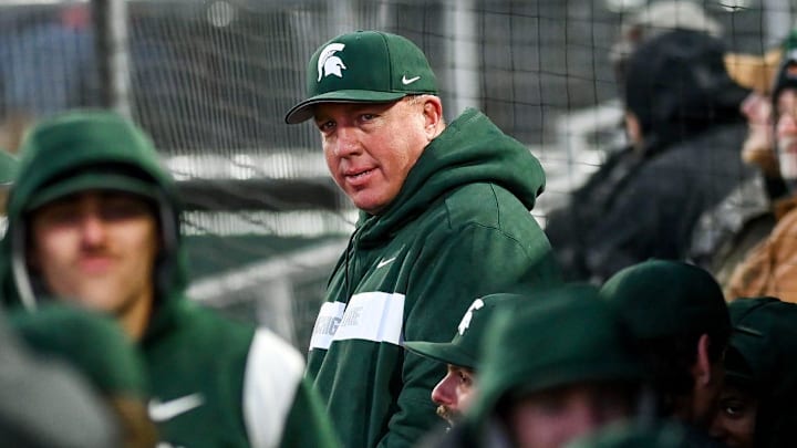 Michigan State's head coach Jake Boss Jr. looks on from the dugout in the third inning on Tuesday, April 4, 2023, during the Crosstown Showdown against Lugnuts at Jackson Field in Lansing.

230404 Msu Lugnuts Bsball 138a