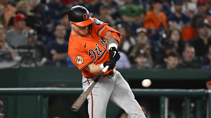 Apr 23, 2025; Washington, District of Columbia, USA; Baltimore Orioles outfielder Tyler O'Neill (9) hits a RBI sacrifice fly against the Washington Nationals during the seventh inning at Nationals Park. 