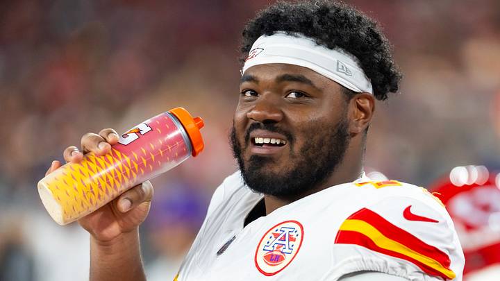 Aug 9, 2025; Glendale, Arizona, USA; Kansas City Chiefs guard Jaylon Moore (77) against the Arizona Cardinals during a preseason NFL game at State Farm Stadium. Mandatory Credit: Mark J. Rebilas-Imagn Images
