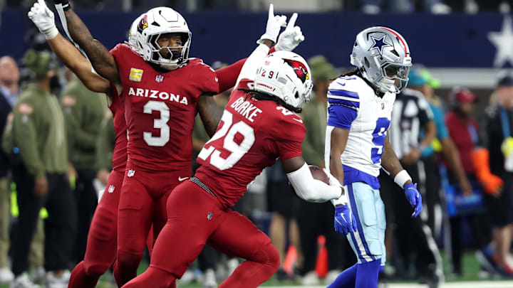 Arizona Cardinals cornerback Denzel Burke celebrates after intercepting a pass by Dallas Cowboys quarterback Dak Prescott.